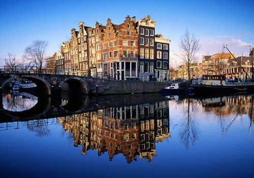 Houses reflected in canal in Amsterdam, the Netherlands/Holland