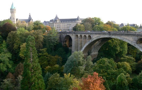 Adolphe Bridge crossing a green valley in Luxembourg City